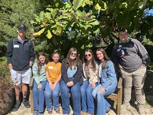 FFA Officers sitting on a bench
